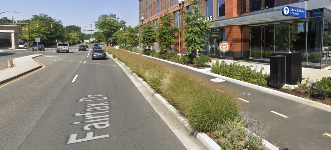 A two-way protected bike lane, where immediately adjacent to the north-most curb is a westbound bike lane, followed by an eastbound bikelane, followed by a raised planted area, followed by the driving lanes for cars.